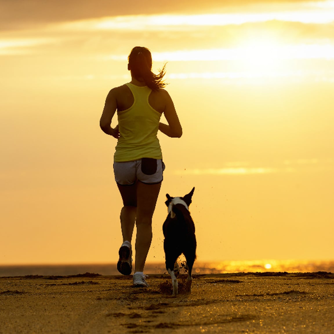 Woman running with dog